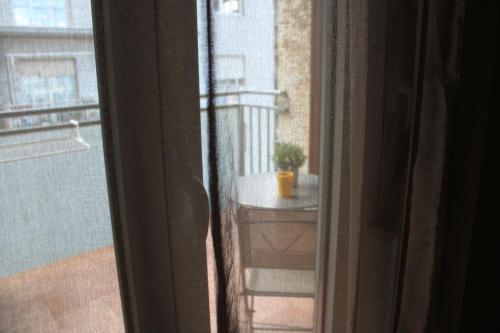 an open window with a view of a balcony at B&B D'Amari Affittacamere in Palermo