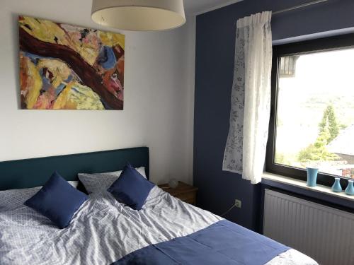 Ένα ή περισσότερα κρεβάτια σε δωμάτιο στο Ferienhaus Schöner Maarblick