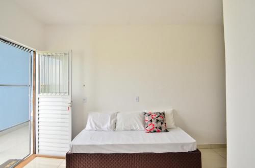 En eller flere senge i et værelse på Sobrado bem iluminado, 5 hóspedes, 15 minutos da Praia N1430