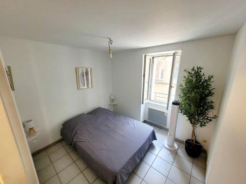 Ένα ή περισσότερα κρεβάτια σε δωμάτιο στο Appartement 2 chambres CENTRE VILLE au calme