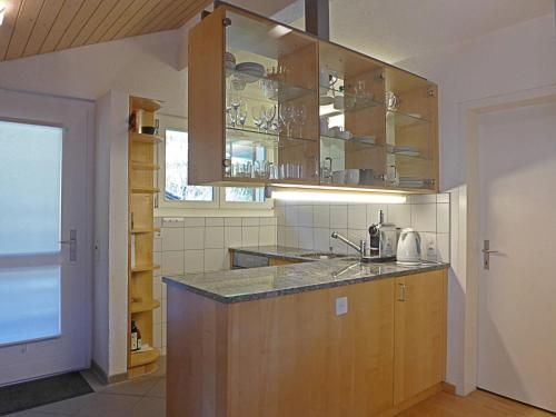 a kitchen with a sink and a counter top at Apartment Melodie by Interhome in Wengen
