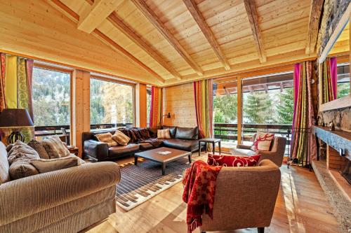 a living room with couches and a fireplace at Chalet Nirvana by Mrs Miggins in Champéry