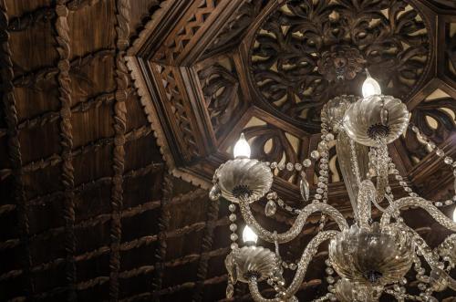 a chandelier hanging from the ceiling of a building at Hani i Xheblatit in Berat