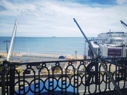 a view of the beach and the ocean from a balcony at Royal Pier in Sandown