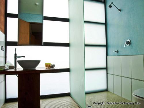a bathroom with a sink and a mirror at The Pemberton Hotel in Pemberton