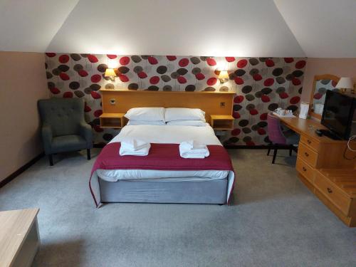 Кровать или кровати в номере The County Lodge