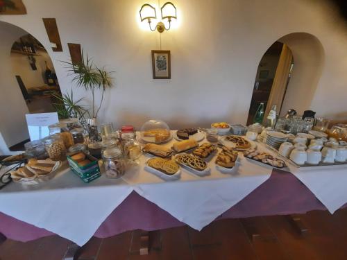 a table with cookies and other food on it at Marco & Andrea Agriturismo Collepina in Amelia