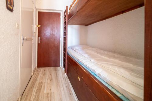 Postel nebo postele na pokoji v ubytování L'Ourson