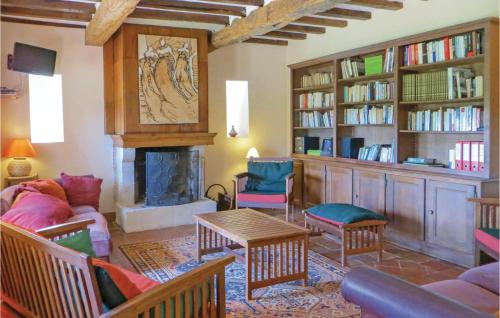 a living room filled with furniture and a fireplace at Stunning Home In Domfront En Champagne in Domfront-en-Champagne