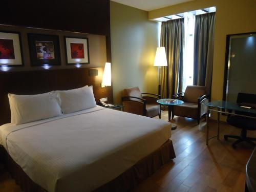 Voodi või voodid majutusasutuse Radisson Blu Atria Bengaluru toas