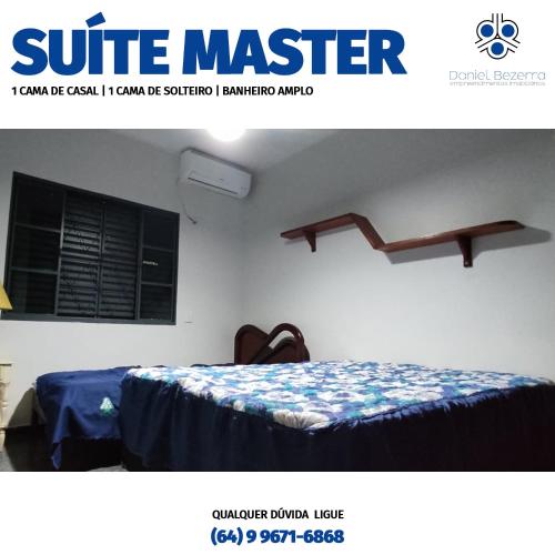 a picture of a bedroom with two beds in a room at Casa com piscina, churrasqueira, 3 suítes com ar condicionado in Caldas Novas
