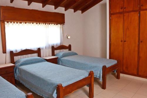 Säng eller sängar i ett rum på Complejo de Mar Wasiyki Villa Gesell