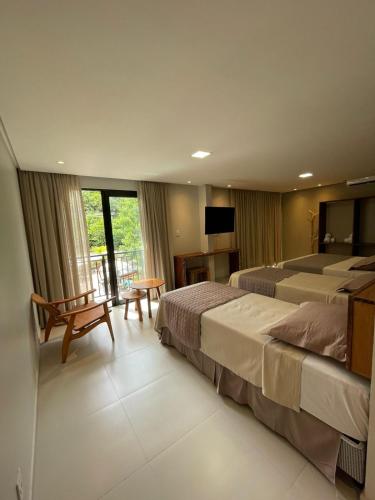 Ein Bett oder Betten in einem Zimmer der Unterkunft Pousada Patuá do Morro