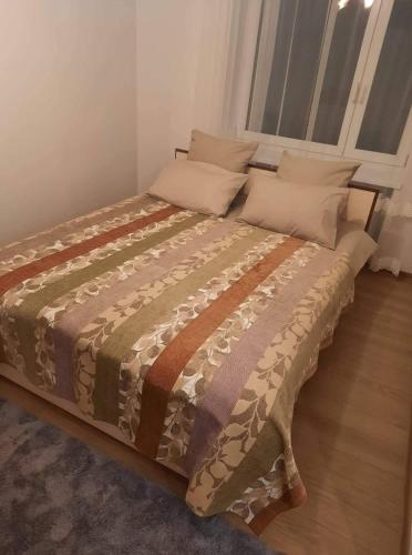 Postel nebo postele na pokoji v ubytování Maironio Apartamentai