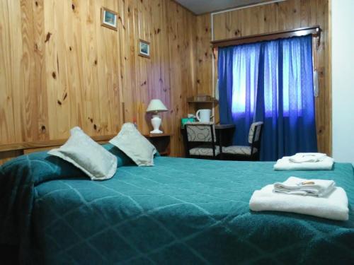 Postel nebo postele na pokoji v ubytování Residencial Sissus