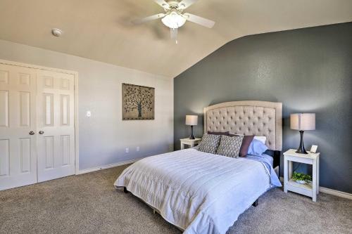 a bedroom with a bed and a ceiling fan at Walk to Grand Lake Modern Afton Townhome! in Afton