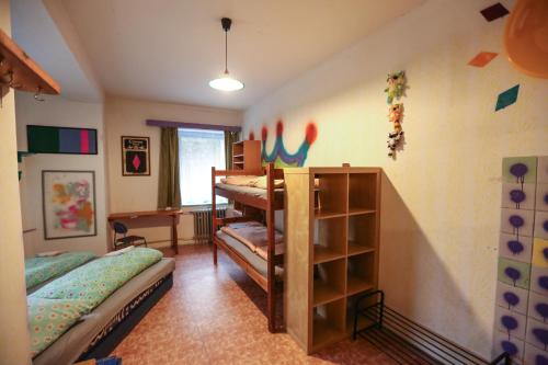 a room with two bunk beds in a room at Hostel KlonDike in Pec pod Sněžkou