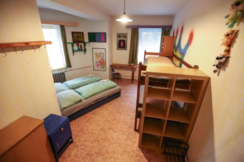 a living room with a couch and a table in it at Hostel KlonDike in Pec pod Sněžkou