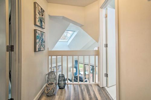 a staircase in a home with a white stair case at 5 Mi to Mashpee Commons Coastal Mashpee Condo in Mashpee