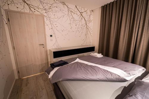Posteľ alebo postele v izbe v ubytovaní Apartmán Kinas, Hillside