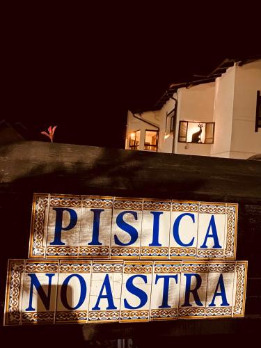 a sign that says pizza no pasta in front of a building at Casa Pisica Noastra in Breaza