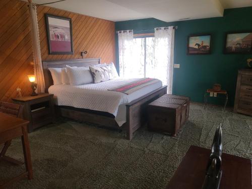a bedroom with a bed and a window at Wildwood Farm Bed & Breakfast in Oak Harbor