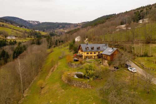 an aerial view of a house on a hill at La Grange d'Hannah - gîte & chambre d’hôtes de charme in Orbey