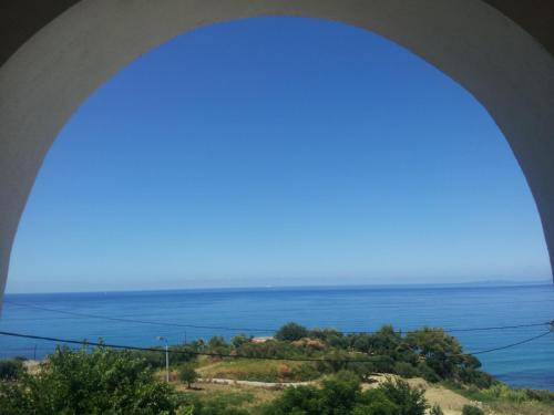 a view of the ocean from a bridge at Hotel Agios Thomas in Ligia
