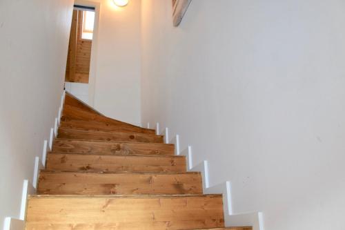 a staircase in a house with wooden floors at Ferienhaus Nockalmbahn in Bad Kleinkirchheim