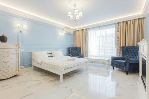 Ένα ή περισσότερα κρεβάτια σε δωμάτιο στο Роскошная 3к квартира 120м2 на набережной в ЖК Obolon Residentsic