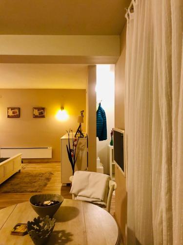 a living room with a table and a couch at VNVP Black Amber in Štip