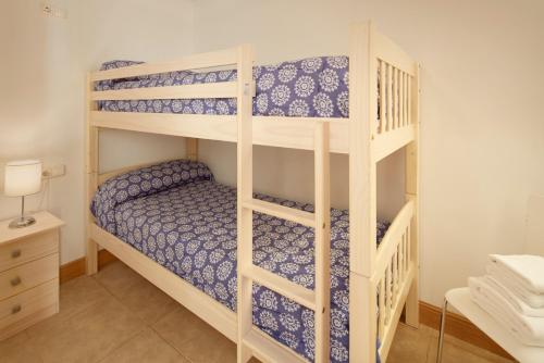 a bunk bed room with two bunk beds at Pensión Txiki Polit in Zarautz