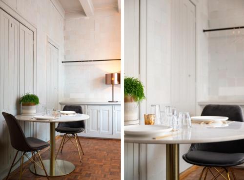 een witte eetkamer met een tafel en stoelen bij De Olde Signorie in Leeuwarden