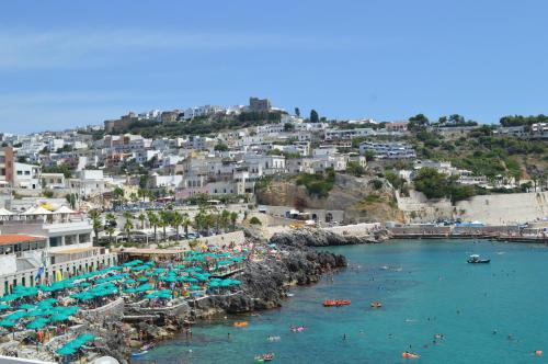 a view of a beach with people in the water at B&B Le Rose in Vignacastrisi