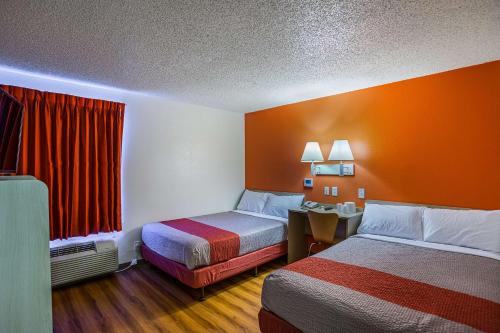a hotel room with two beds and a window at Motel 6 Tucson, AZ - North in Tucson