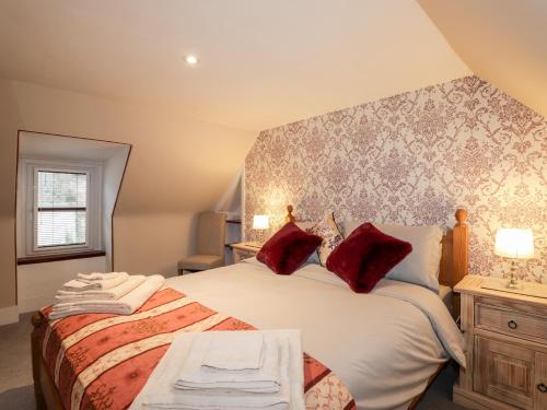 Ένα ή περισσότερα κρεβάτια σε δωμάτιο στο Griffin Cottage