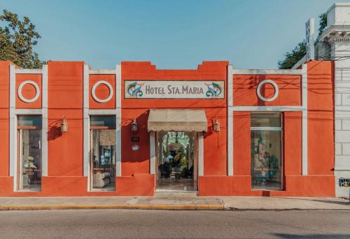 an orange building on the side of a street at Hotel Santa María Mérida in Mérida