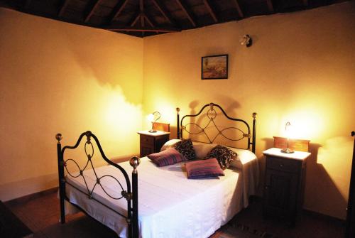 Ένα ή περισσότερα κρεβάτια σε δωμάτιο στο Casa Bana I