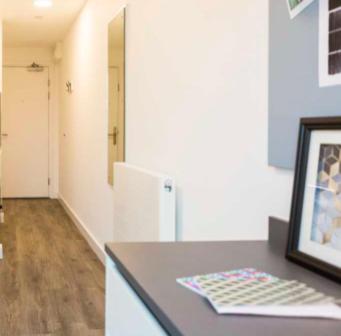 a kitchen with a counter top with a picture on it at Student/one person accommodation flat in London