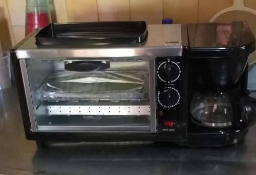 a toaster oven sitting on top of a counter at La casa azul in Cartagena de Indias