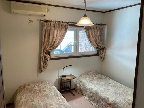 A bed or beds in a room at Landhaus Dancru Netz