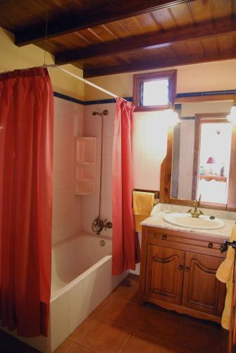 a bathroom with a tub and a sink and a shower at Casa Bana 2 in El Paso