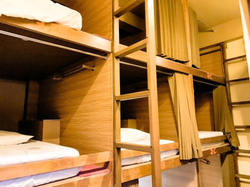 a room with several bunk beds in it at Omah Pelem Syariah in Semarang