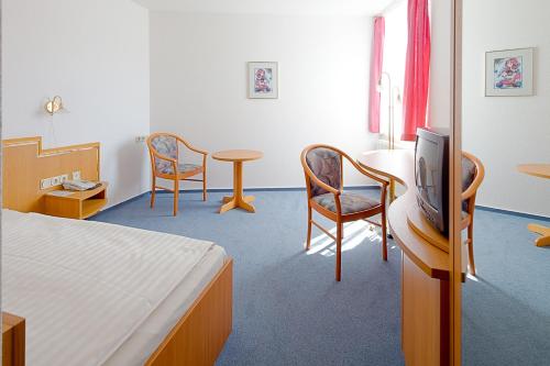 Un ou plusieurs lits dans un hébergement de l'établissement Hotel Jahnke