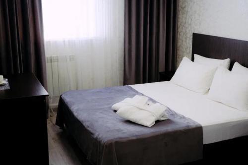 Postel nebo postele na pokoji v ubytování Rush Hotel