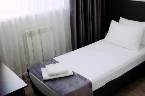 Postel nebo postele na pokoji v ubytování Rush Hotel