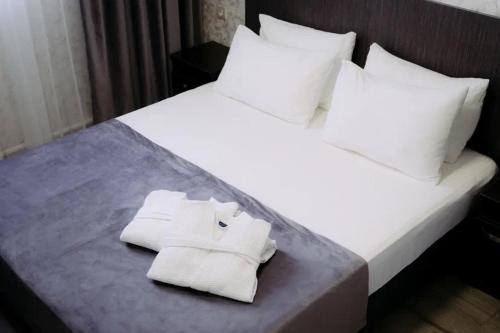 Кровать или кровати в номере Rush Hotel