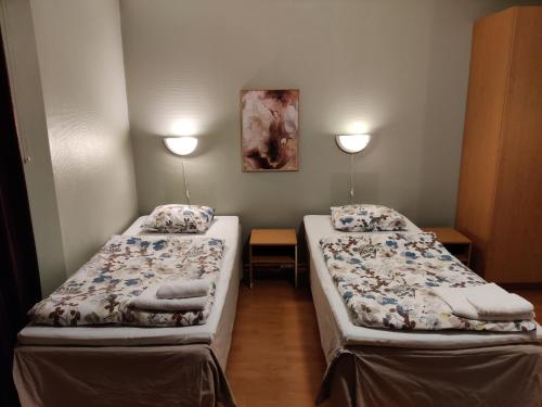 Postel nebo postele na pokoji v ubytování Hotelli Merikotka