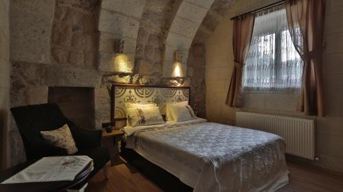 Postelja oz. postelje v sobi nastanitve Sakli Konak Cappadocia Hotel&Restaurant