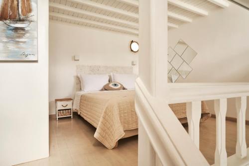 Кровать или кровати в номере Mykonos City Villas